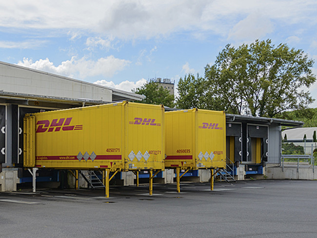 Lorry docking station where containers are being loaded